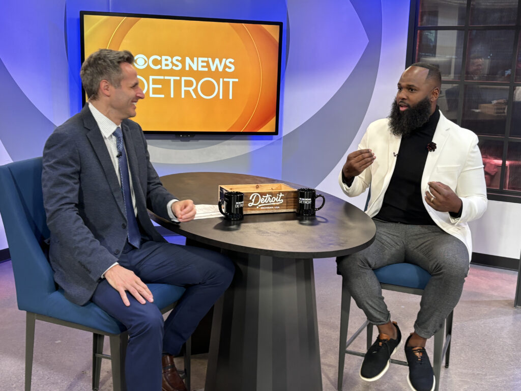 Andre Fluellen on stage at a conference