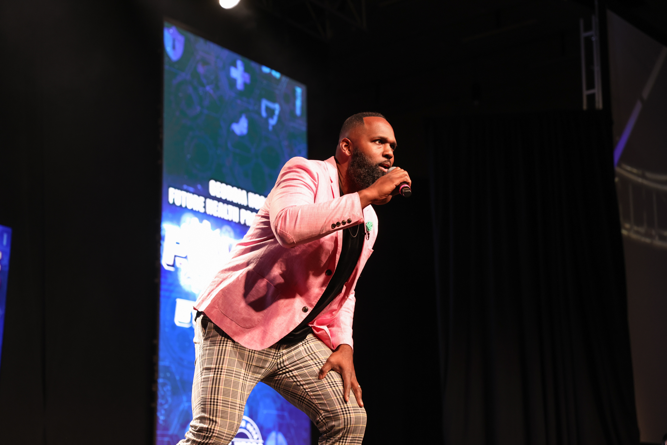 Andre Fluellen engaging with a corporate audience during a keynote presentation
